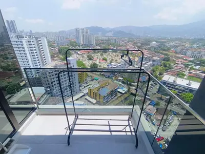 a chair on top of a building in a city at Rooftop Pool, Up to 6 Pax, 2 Bedrooms, 2 Bathrooms, 2 Car Parks by Star Home in George Town