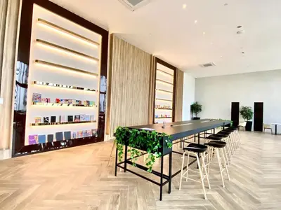 a long black table with chairs in a room at Rooftop Pool, Up to 6 Pax, 2 Bedrooms, 2 Bathrooms, 2 Car Parks by Star Home in George Town