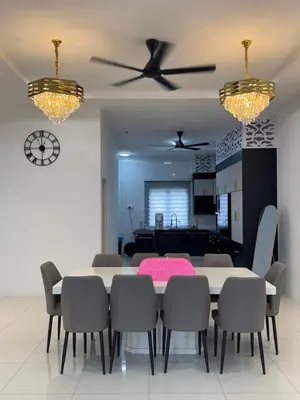 a dining room with a table and chairs at Ramadhina The Luxe Retreat Home2stay Ipoh in Ipoh