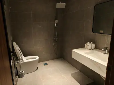 a bathroom with a toilet and a sink at Rumah Atuk Homestay in Gua Musang