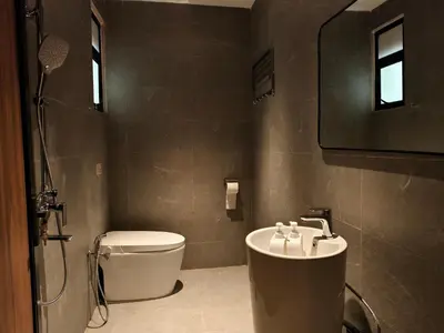 a bathroom with a toilet and a sink at Rumah Atuk Homestay in Gua Musang