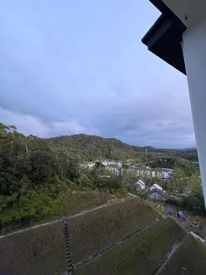 a view of a hill with houses and a city at Zuls Apartment Homestay Cameron Highlands in Tanah Rata