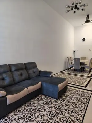 a living room with a couch and a table at FH Homestay Kuala Lipis 3R2B in Kuala Lipis