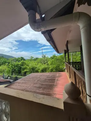 a view from the balcony of a house at Homestay Sayang Salmah in Balik Pulau