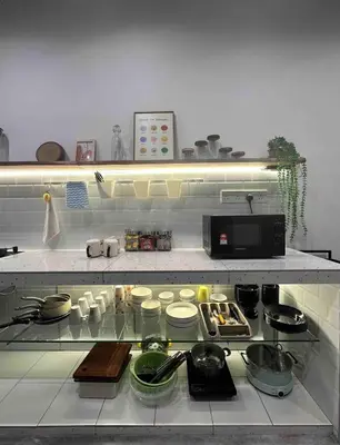 a kitchen with a counter top with pots and pans at Moonine Homes Taiping in Kamunting