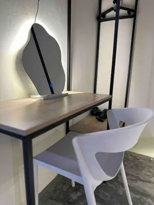 a desk with a computer on it with a chair at Moonine Homes Taiping in Kamunting
