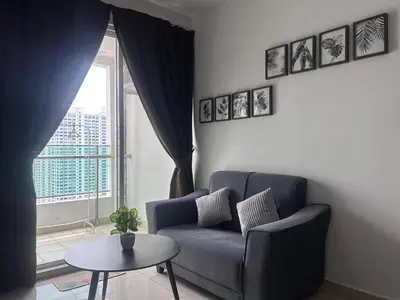 a living room with a couch and a table and a window at Georgetown 2R1B Gleneagle Gurney City Sea view in George Town