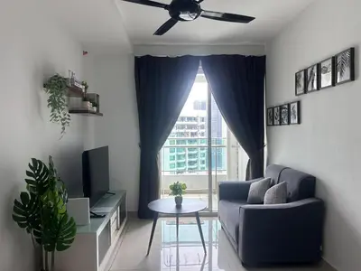a living room with a blue couch and a window at Georgetown 2R1B Gleneagle Gurney City Sea view in George Town