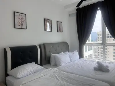 a bedroom with a bed and a large window at Georgetown 2R1B Gleneagle Gurney City Sea view in George Town