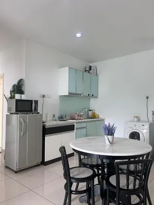 a kitchen with a table and chairs and a refrigerator at Georgetown 2R1B Gleneagle Gurney City Sea view in George Town