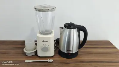 a blender sitting on top of a wooden counter at City Sea View 2R2B Georgetown Gleneagle 9pax in George Town