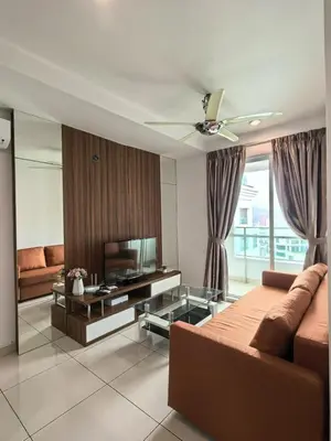 a living room with a couch and a flat screen tv at City Sea View 2R2B Georgetown Gleneagle 9pax in George Town
