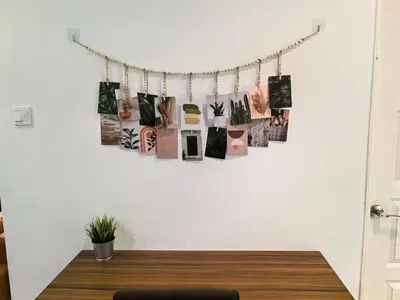 a room with a table with pictures on the wall at City Sea View 2R2B Georgetown Gleneagle 9pax in George Town