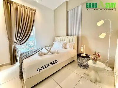 a bedroom with a queen bed and a window at ICC Luxury Suites by Grab A Stay in Ipoh