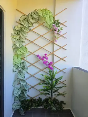 a wall art with a plant and flowers at The Highland Hive in Tanah Rata