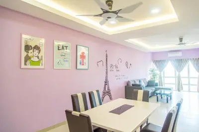 a dining room with a table and chairs at Lavender Home in Sekincan