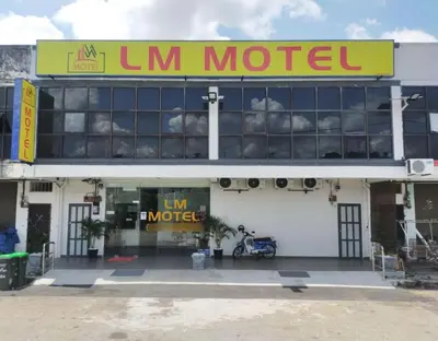 a sign on the front of a motel at LM Motel in Kulim