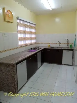 a kitchen with a sink and a counter top at SRS WIN Homestay BPJ in Sungai Petani