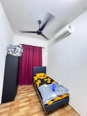 a bedroom with a bed and a ceiling at Homestay Tanah Liat in Bukit Mertajam