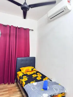 a bedroom with a bed and a purple curtain at Homestay Tanah Liat in Bukit Mertajam