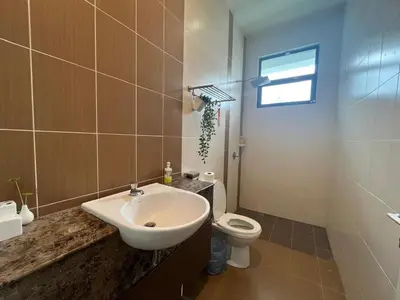 a bathroom with a sink and a toilet at Asimmy Homestay Semi-D with 4 rooms in Kampong Gurun