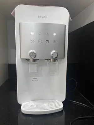 a white wii controller sitting on top of a counter at Asimmy Homestay Semi-D with 4 rooms in Kampong Gurun