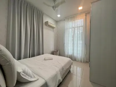 a bedroom with a white bed and a window at Asimmy Homestay Semi-D with 4 rooms in Kampong Gurun