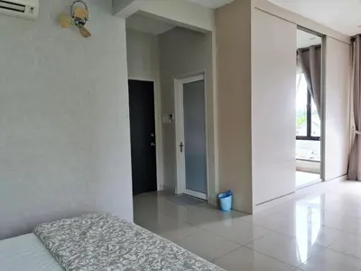 a bedroom with a bed and a large window at Asimmy Homestay Semi-D with 4 rooms in Kampong Gurun