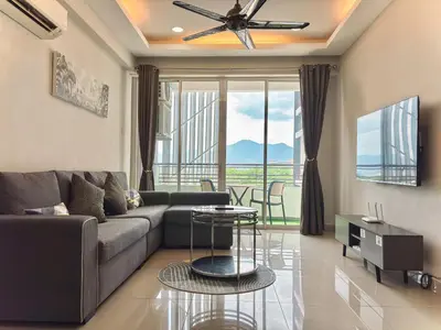 a living room with a couch and a table at Majestic Condo Ipoh Central by PLY Home in Ipoh