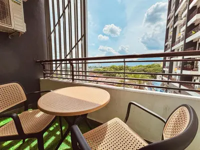 a table and chairs on a balcony with a view at Majestic Condo Ipoh Central by PLY Home in Ipoh