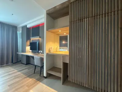 a room with two desks and a computer in it at Hotel Warisan in Taiping