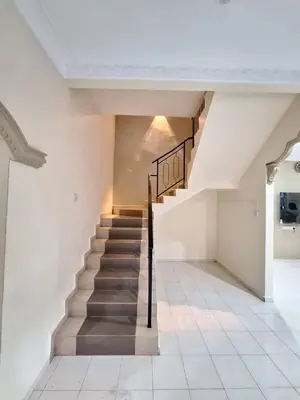 a stairway in a building with a stair case at LB Homestay in Lunas