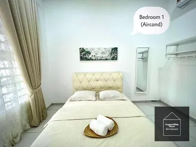 a white bedroom with a bed with a basket on it at Homestay Meru Ipoh Mus Lim Only Tropical White House in Ipoh