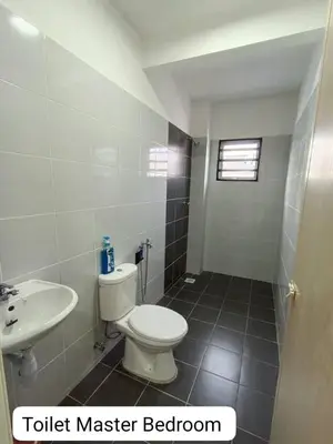 a bathroom with a toilet sink and a toilet master bathroom at Homestay AinulZahra- For Malays Only in Seri Iskandar