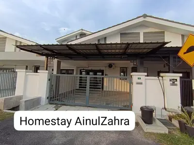 a house with a wooden pergola in front of it at Homestay AinulZahra- For Malays Only in Seri Iskandar