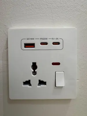 a white light switch on a wall at ICC Suites Ipoh City Centre Walking Distance to Shopping Mall in Ipoh