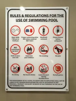 a sign that says rules and regulations for the use of swimmingpool at ICC Suites Ipoh City Centre Walking Distance to Shopping Mall in Ipoh