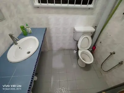 a bathroom with a sink and a toilet at GHome Cheerful comfort home in Butterworth