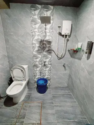 a bathroom with a toilet and a shower at fz north silibin in Ipoh