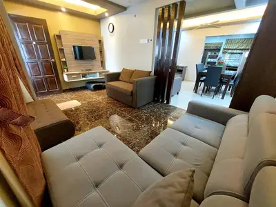a living room with a couch and a tv at fz north silibin in Ipoh