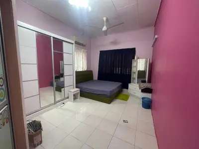 a pink room with a bed and a mirror at ZzHomestay