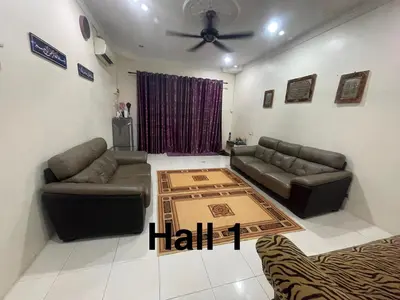 a living room with two couches and a ceiling fan at ZzHomestay