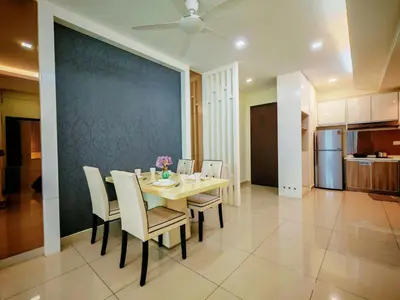 a dining room with a table and chairs at Ipoh Majestic Modern City 2BR Condo - Food Street in Ipoh