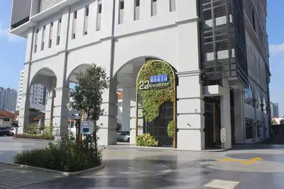 a large white building with an archway on a street at SkyPool at 22Macalisterz - Georgetown City Centre, 4pax by PG Home in George Town