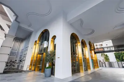 a large white building with large glass windows at SkyPool at 22Macalisterz - Georgetown City Centre, 4pax by PG Home in George Town
