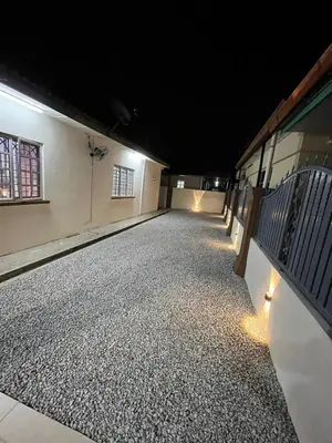 a dark room with a row of benches and lights at KMK Homestay in Sungai Petani