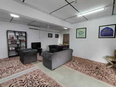 a living room with two chairs and a couch at DRH Villa in Ipoh