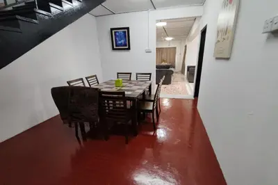 a dining room with a table and chairs at DRH Villa in Ipoh