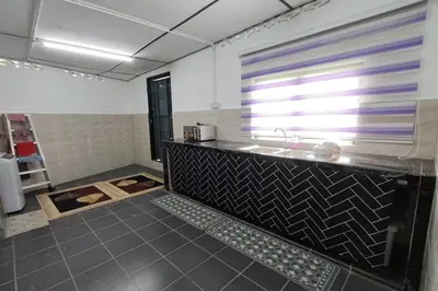 a bathroom with a sink and a counter at DRH Villa in Ipoh