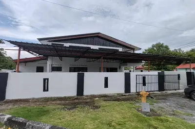 a white fence in front of a house at DRH Villa in Ipoh